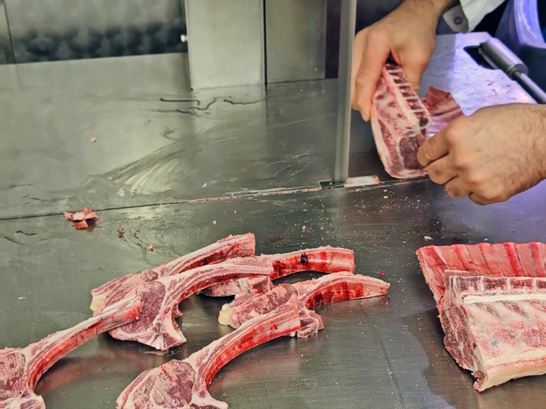 Filming the meat counter at Ikhlas Halal Butcher, Bradford