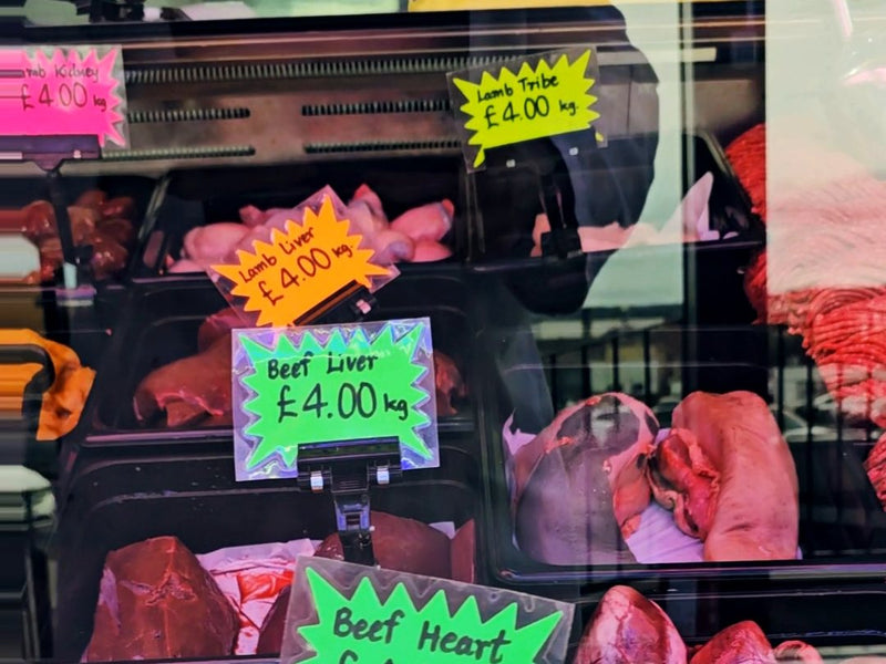 Close-up of price tickets on the meat counter at Ikhlas Halal Butcher, Bradford