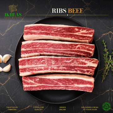 Raw halal beef ribs on a white background, photographed for a butcher website