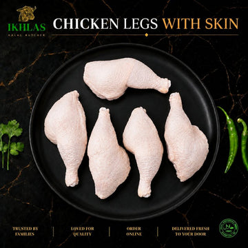 Raw halal chicken legs on a white background, photographed for a butcher website