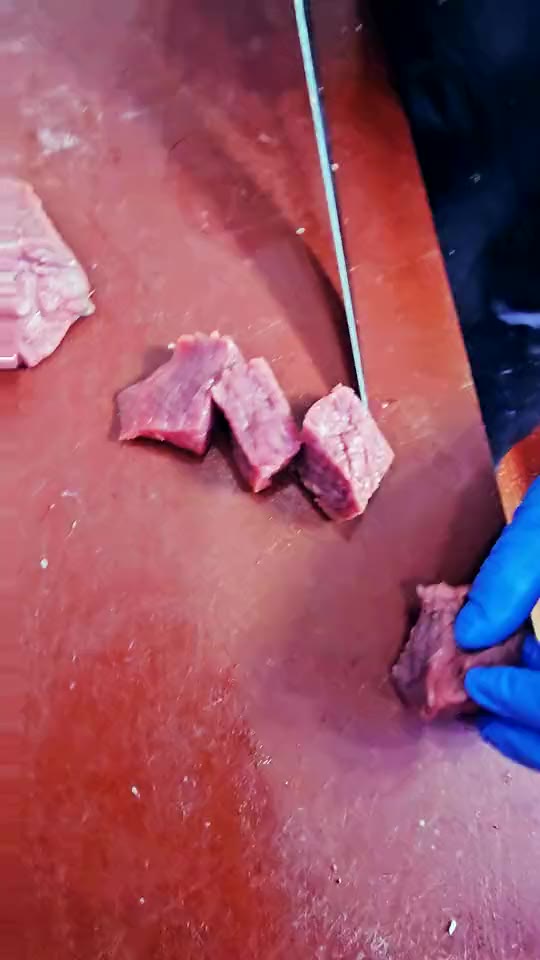 Dicing a curry cut at Ikhlas Halal Butcher