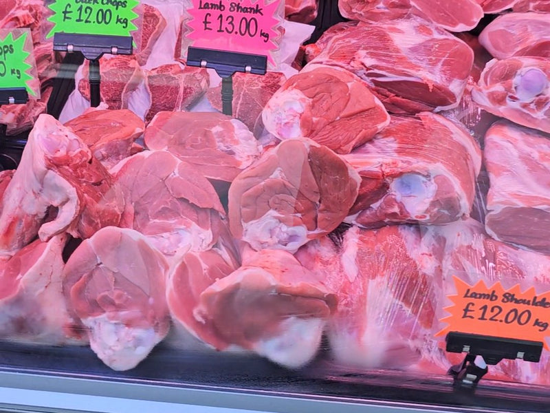 Price tickets on the counter at Ikhlas Halal Butcher