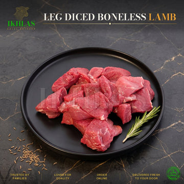 Raw halal diced lamb on a white background, photographed for a butcher website