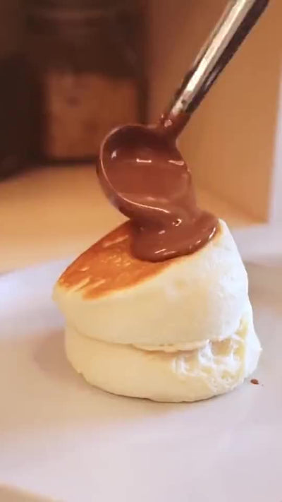 Chocolate poured over a dessert