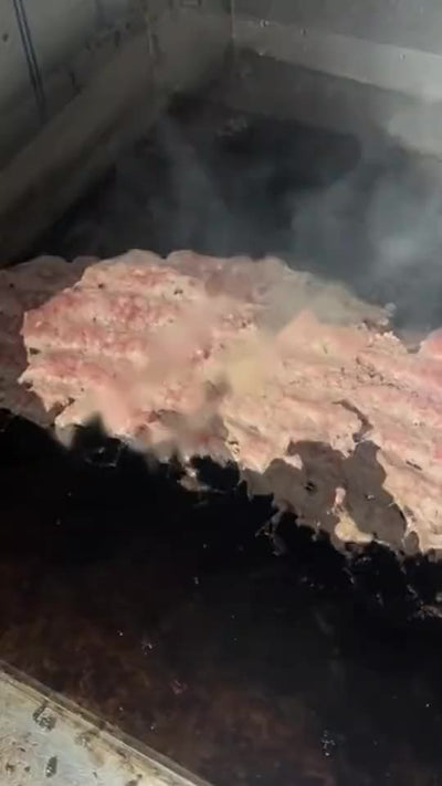 Smash burger patties on the griddle