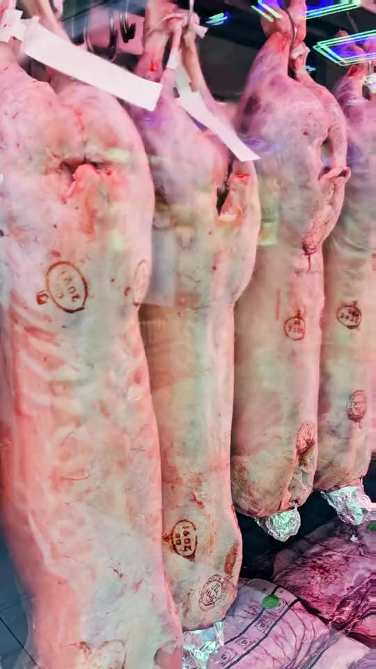 Lamb hanging in the chiller at Ikhlas Halal Butcher