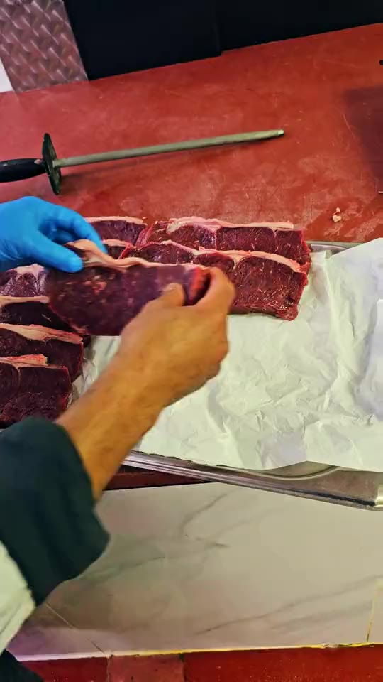 Steaks laid on paper at Ikhlas Halal Butcher